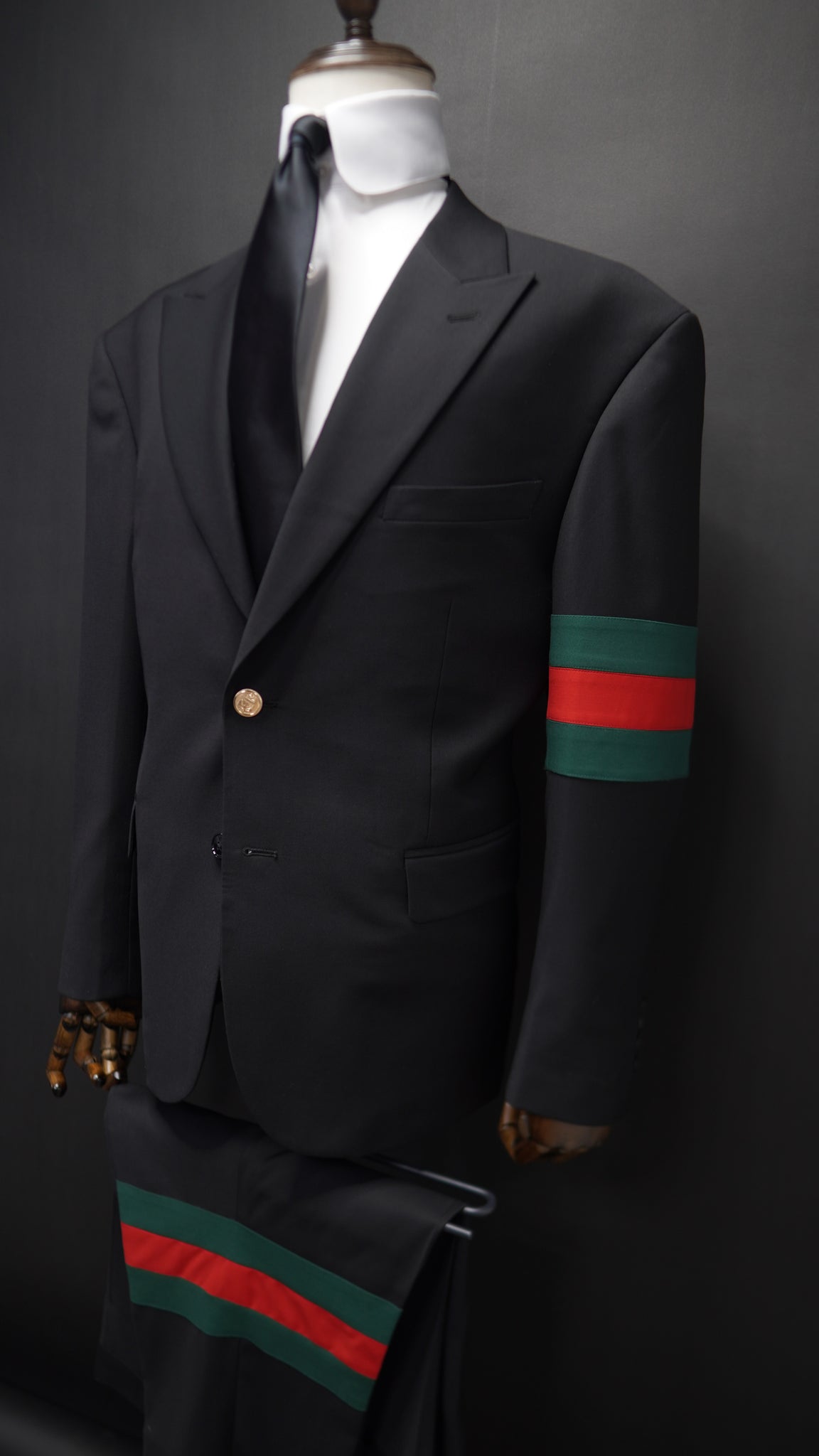 Black Peak lapel suit with Green & Red Armband