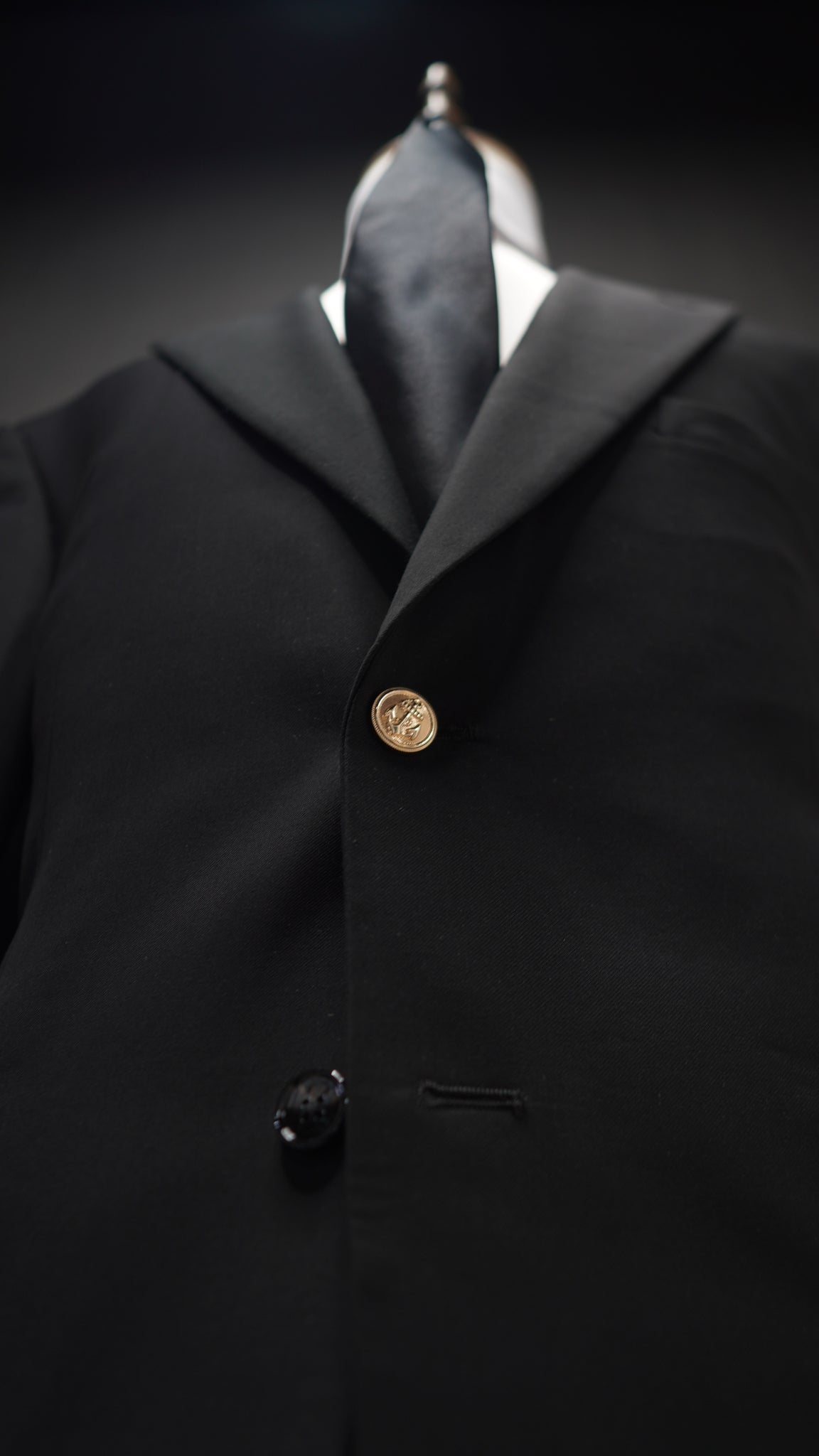 Black Peak lapel suit with Green & Red Armband
