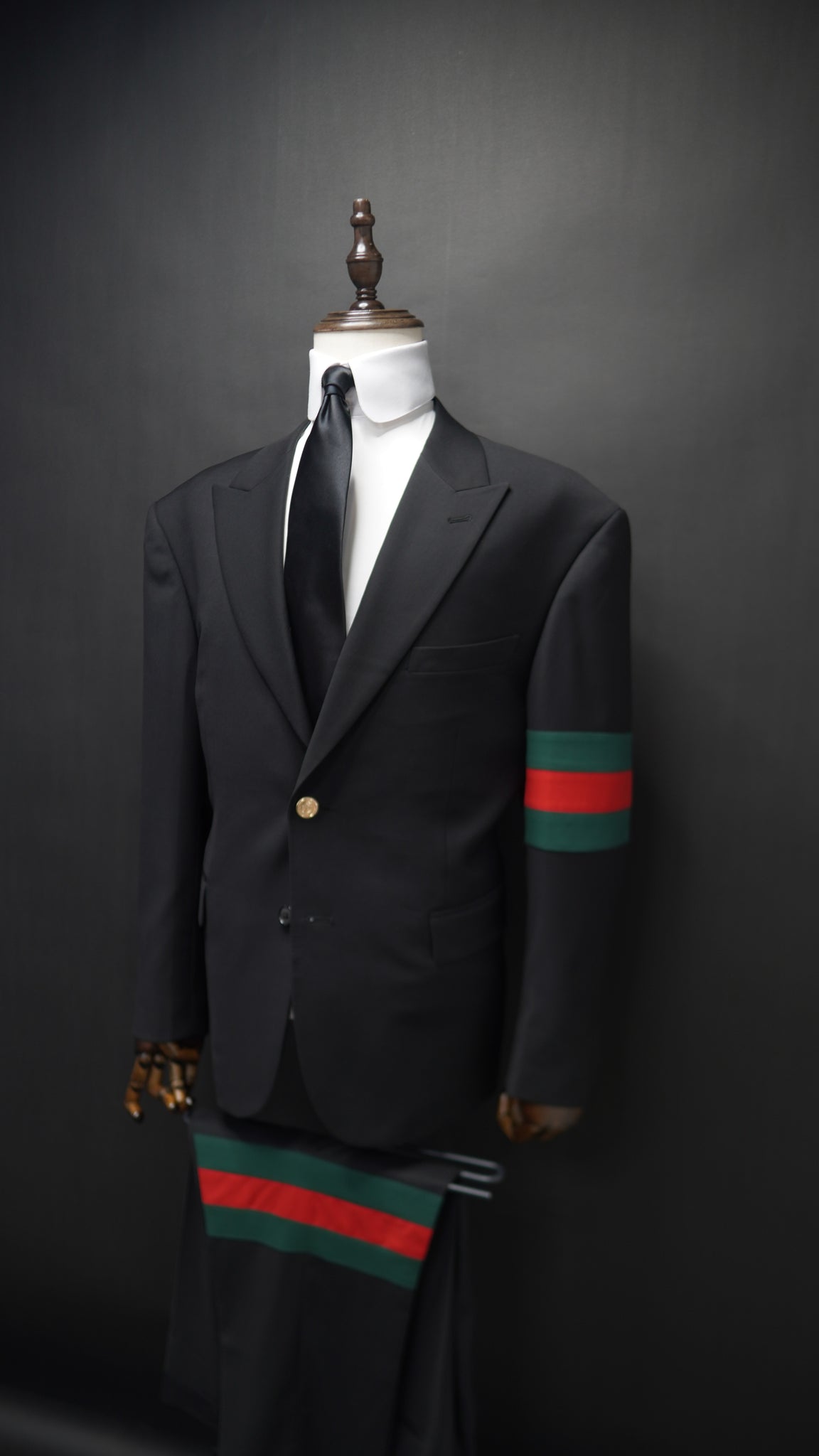 Black Peak lapel suit with Green & Red Armband
